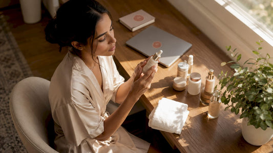 Woman applying skincare serum in bathroom