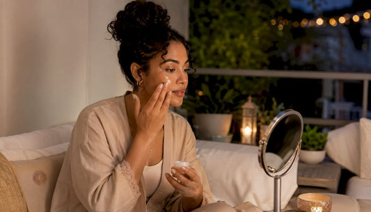 Woman applying petrolatum in nighttime skincare