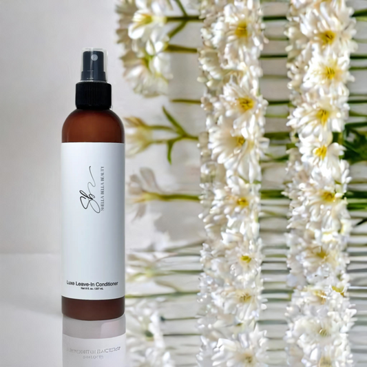 PureLuxe RadiantSilk Silkening Veil leave in conditioner housed in a brown bottle with white label against a floral background