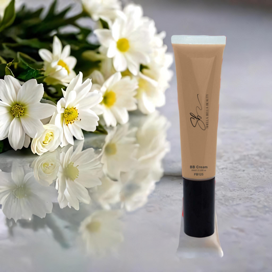 A tube of RadiantBlend Beachy BB Bliss Cream SPF 18 with a bouquet of white flowers in the background.